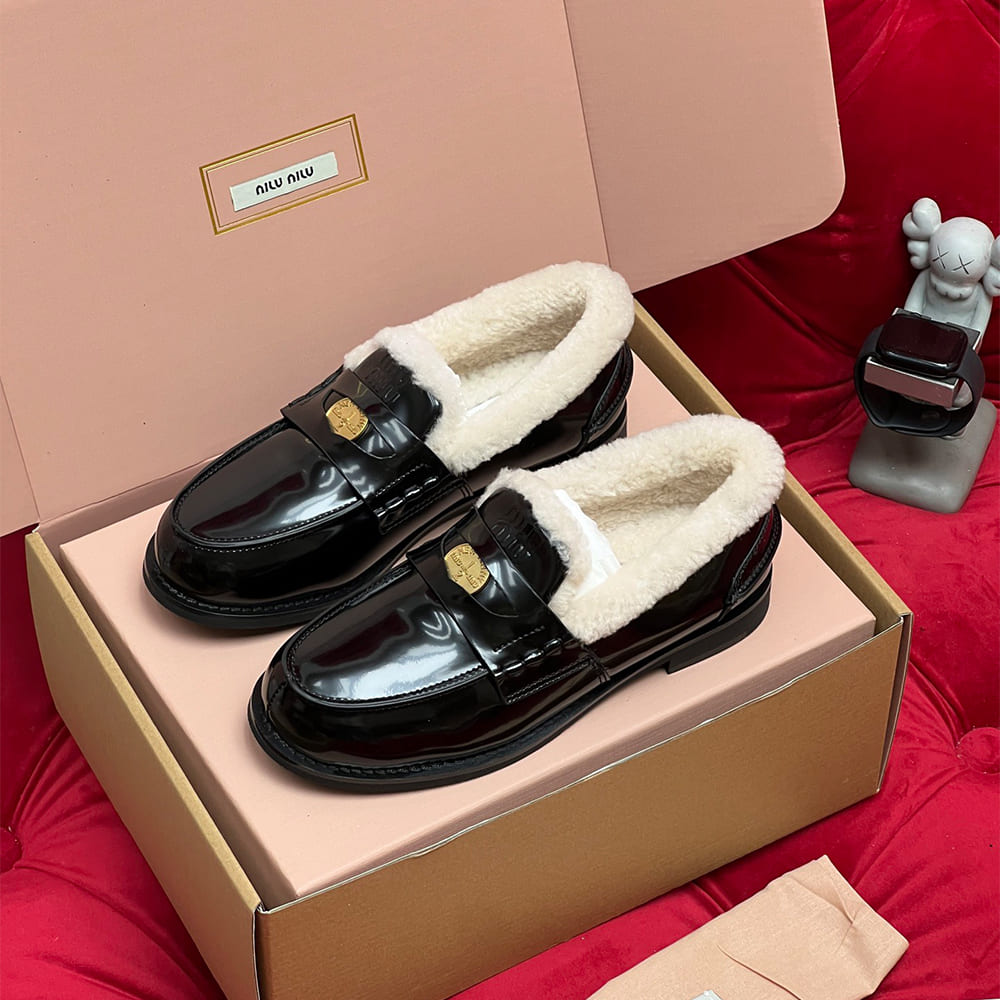 M1um1u Bleached leather and shearling penny loafers