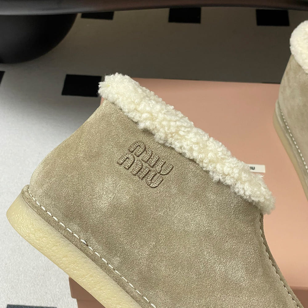 M1um1u Suede and shearling slip-on booties